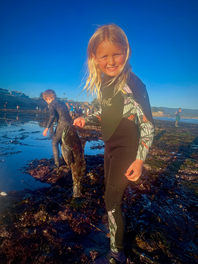 Minus tides offer poke poling fun for youngsters