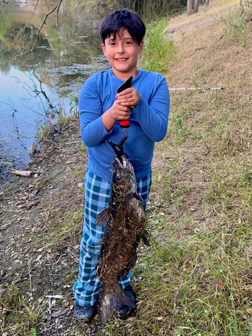 11 POUND Catfish caught from their campsite!!